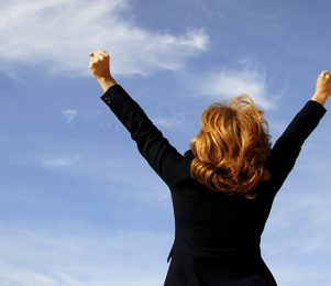 Businesswoman shouting her victory to the world